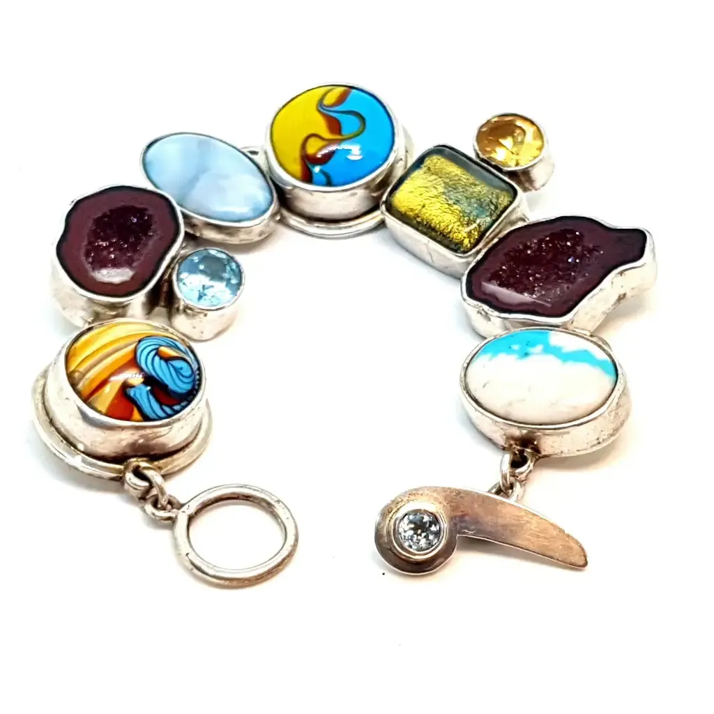 Original and special silver bracelet with enamel and different natural stones.