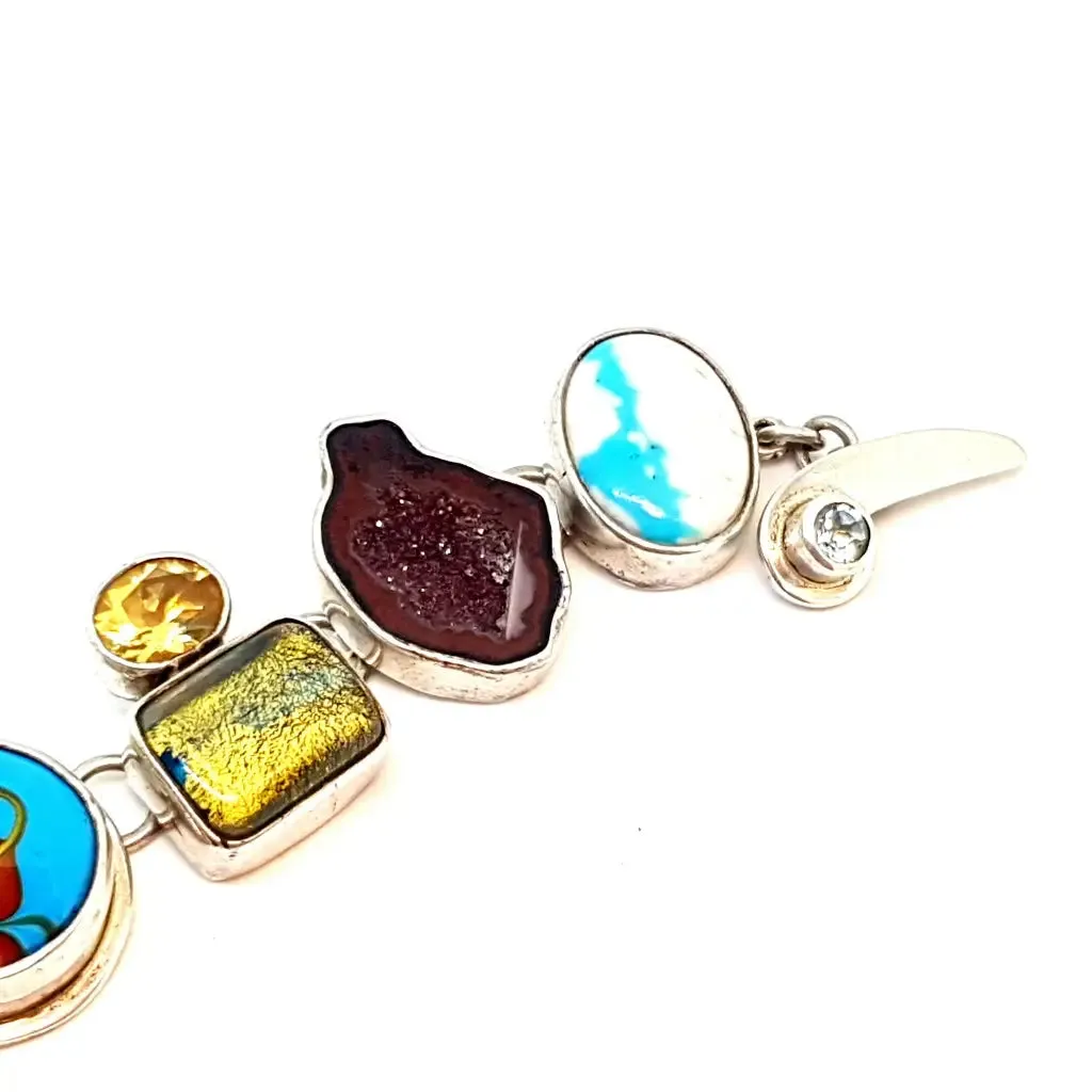 Original and special silver bracelet with enamel and different natural stones.