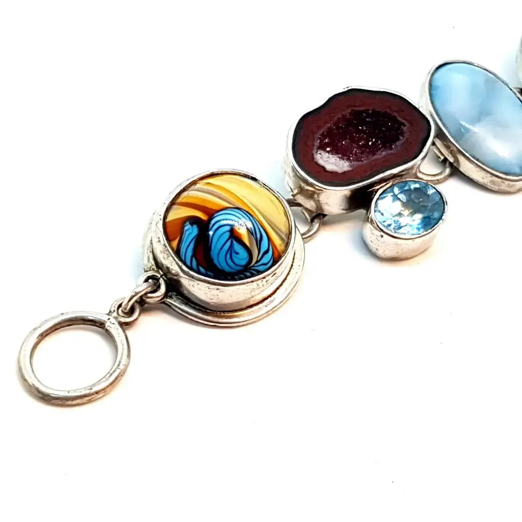 Original and special silver bracelet with enamel and different natural stones.