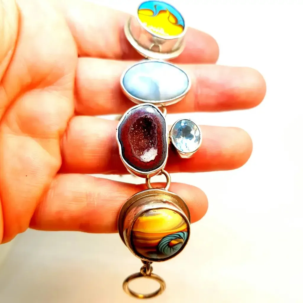 Original and special silver bracelet with enamel and different natural stones.