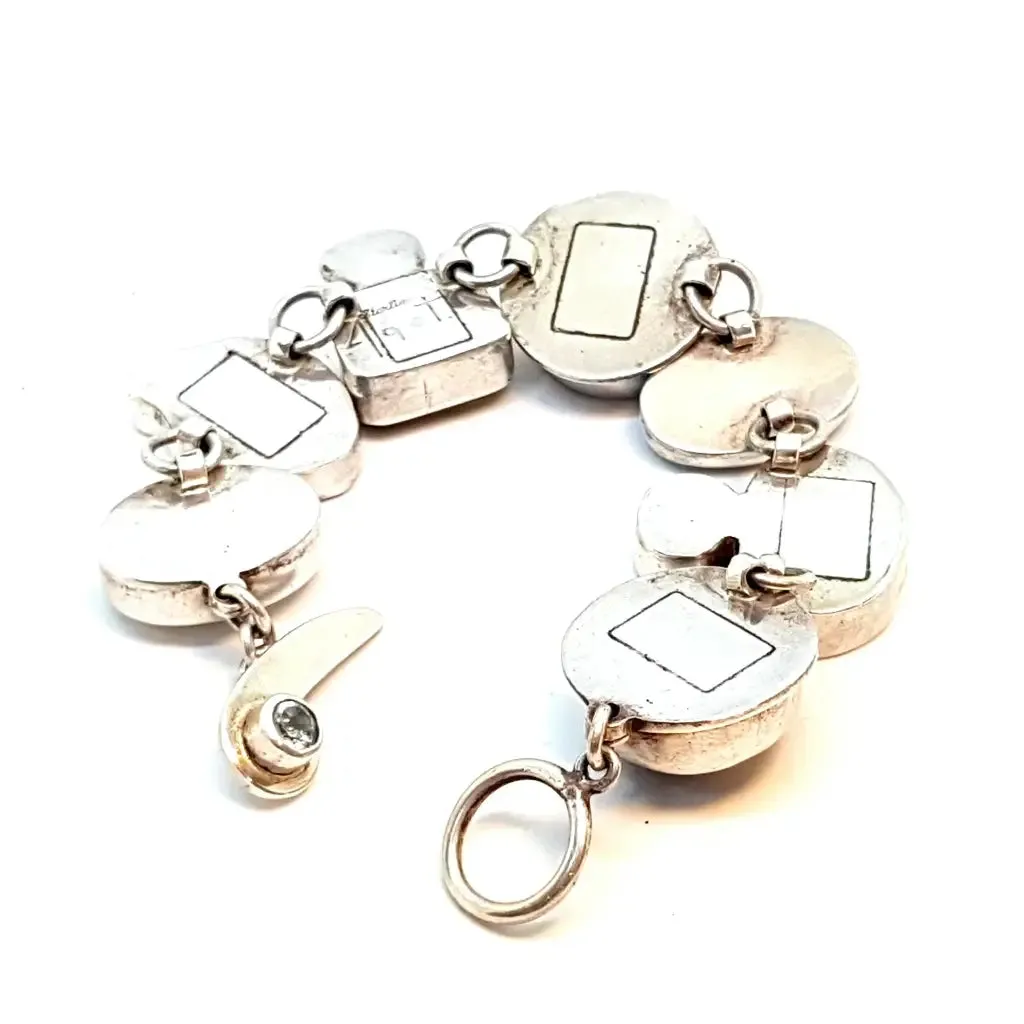 Original and special silver bracelet with enamel and different natural stones.