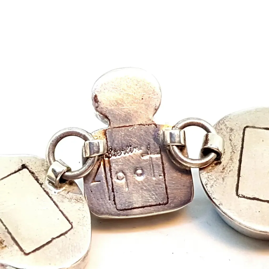 Original and special silver bracelet with enamel and different natural stones.