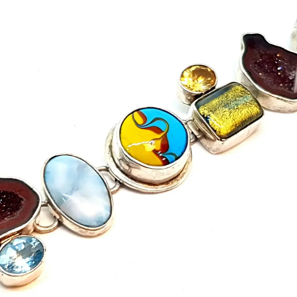 Original and special silver bracelet with enamel and different natural stones.